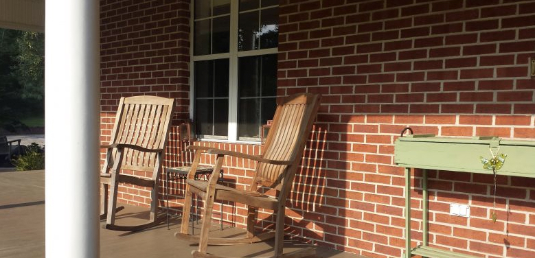 two rocking chairs on a porch